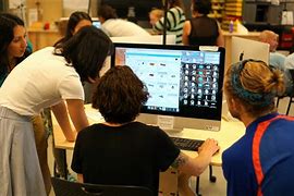 teacher using chatgpt with student in the classroom